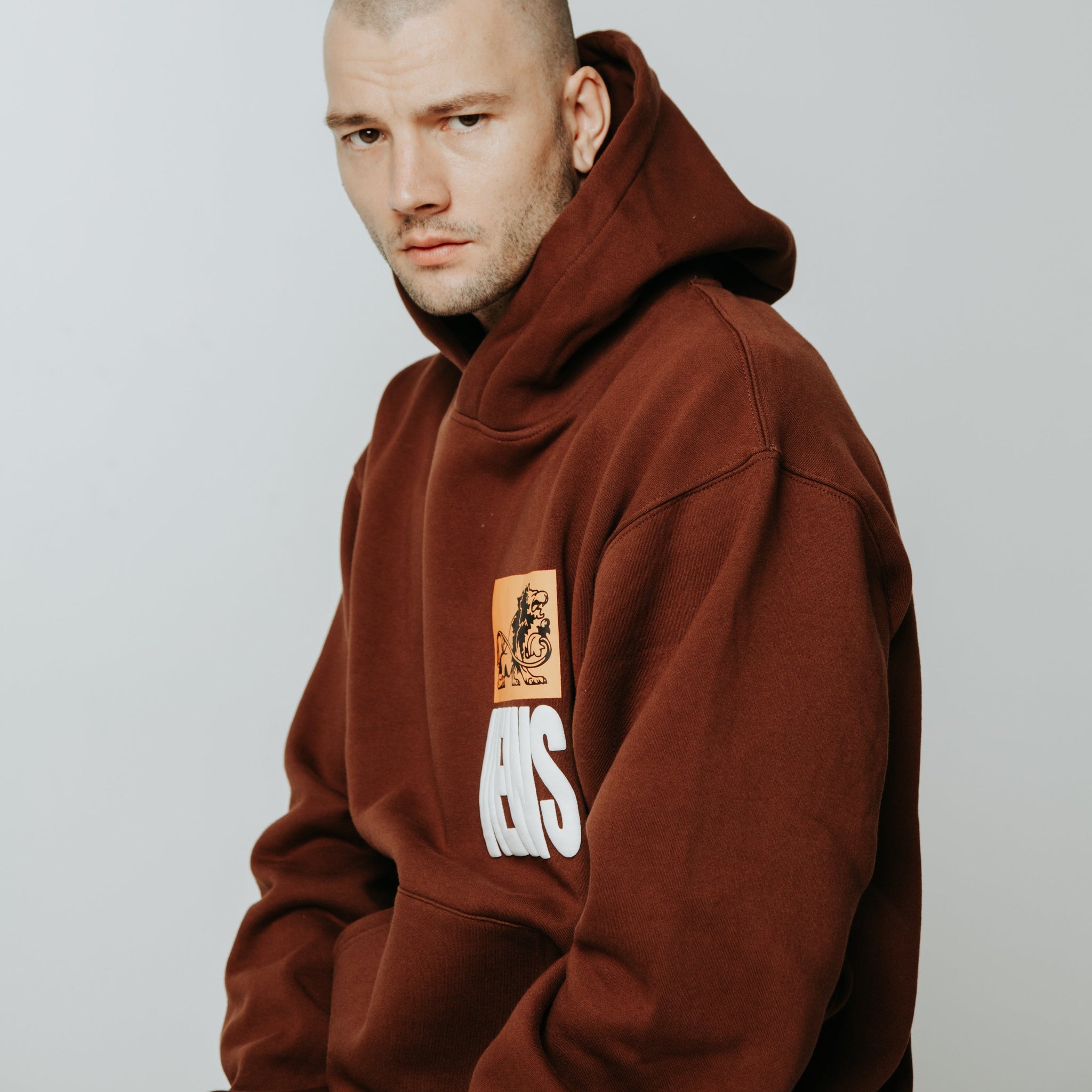 Streetwear oversized brown hoodie with buff print  السعوديةهودي اوفرسايز بني ماركة ثلاثة وعشرين ٢٣ studio 23