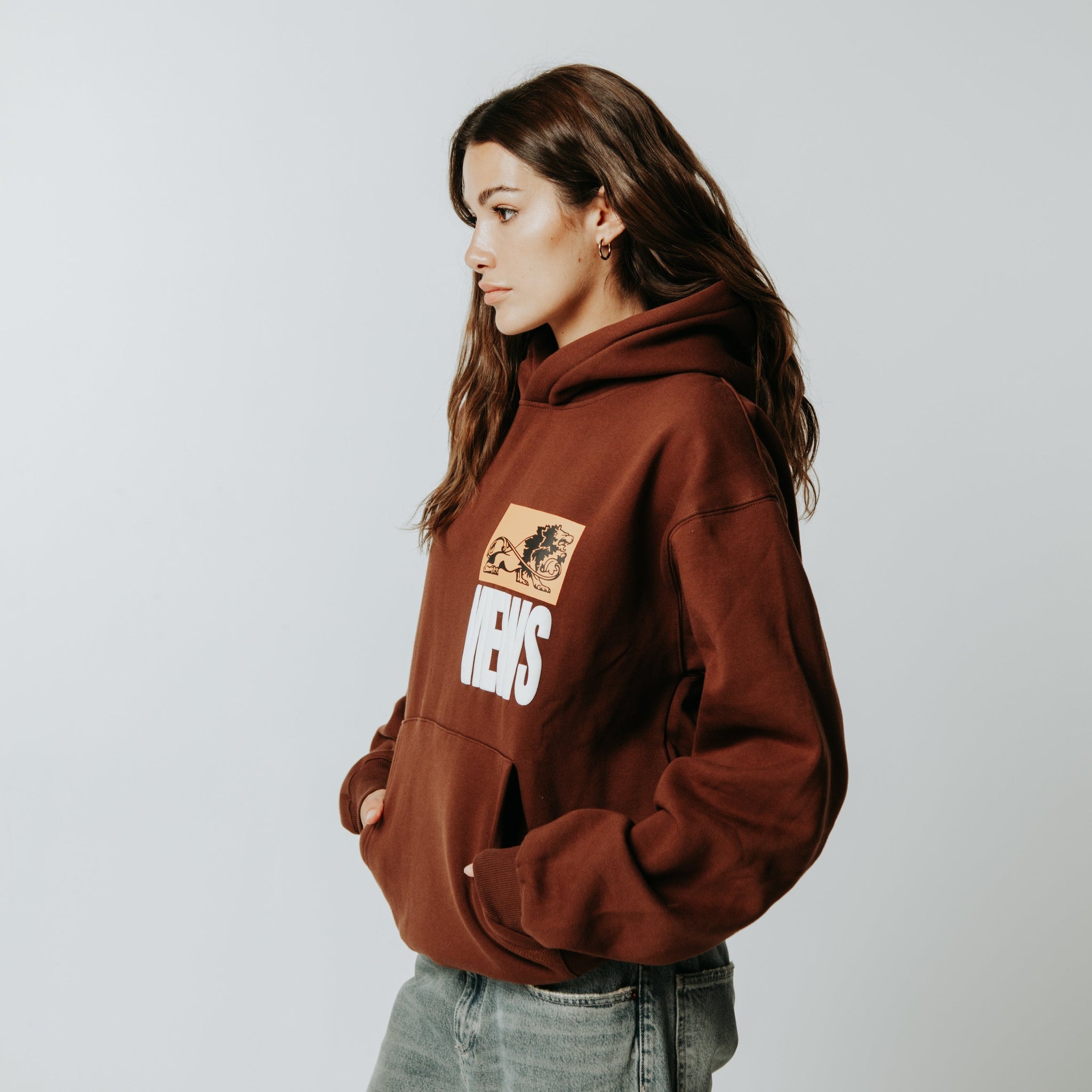 Streetwear oversized brown hoodie with buff print  السعوديةهودي اوفرسايز بني ماركة ثلاثة وعشرين ٢٣ studio 23